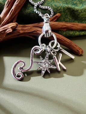 Monk DND necklace with the wind, a star, and KI Dungeons and Dragons jewelry